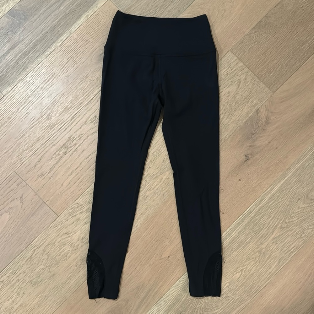 Black cropped leggings with mesh detail